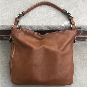 Naturalized cognac satchel. Over the shoulder